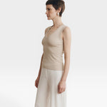 JONES + CO Dune ribbed knit tank top with a deep scoop neckline on a woman.