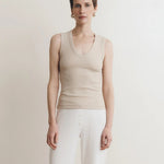 JONES + CO Dune ribbed knit tank top with deep scoop neckline on a woman.