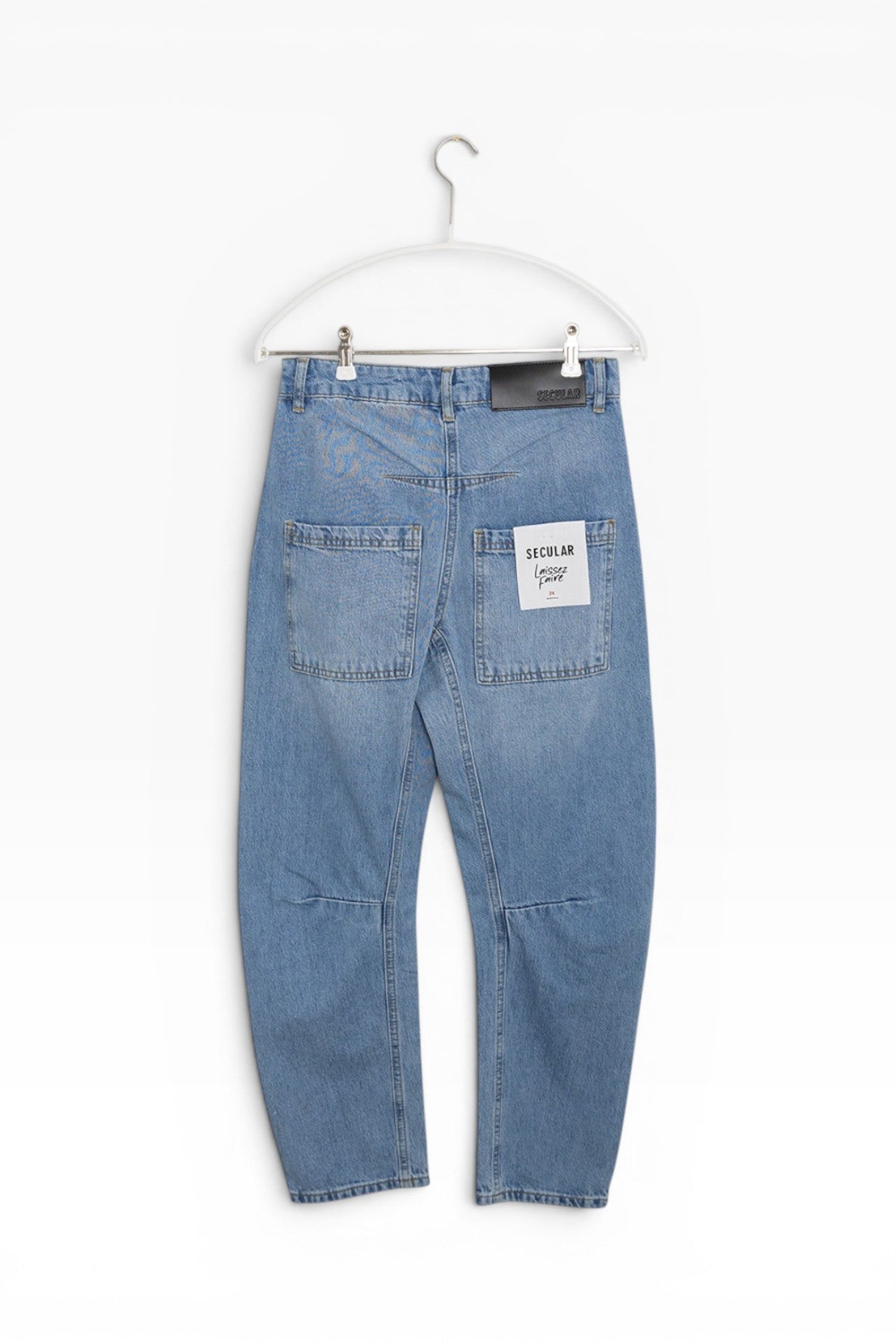JONES + CO Easton Jean in malibu wash denim. Relaxed fit jeans with a straight leg and unique paneling detail.