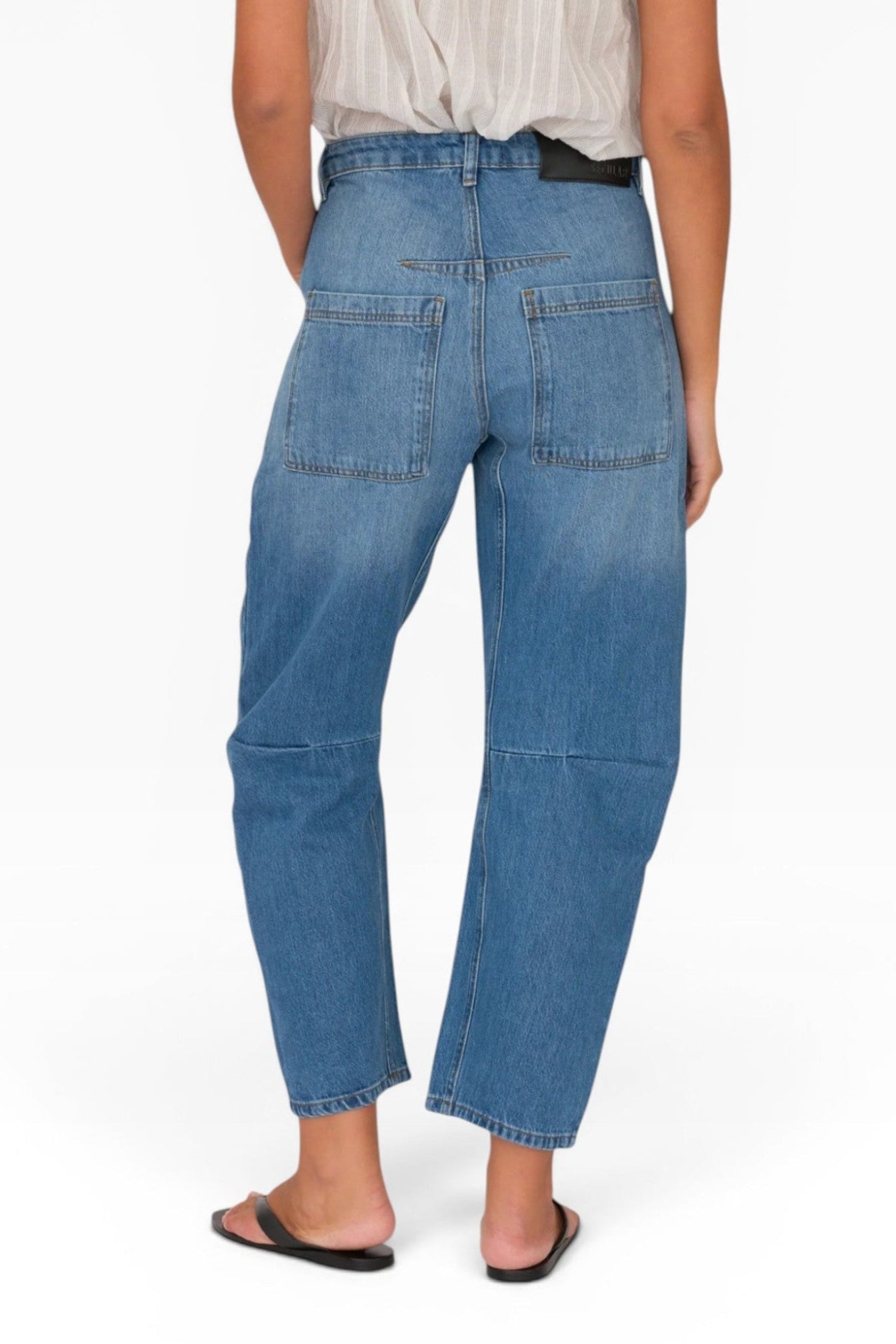 JONES + CO Easton Jean in malibu wash denim. Relaxed fit, straight leg jeans with patch pockets and a mid-rise waist.