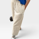 JONES + CO ecru Gardener's Pants in lightweight cotton-nylon with an elastic drawstring waist and a relaxed tapered leg.