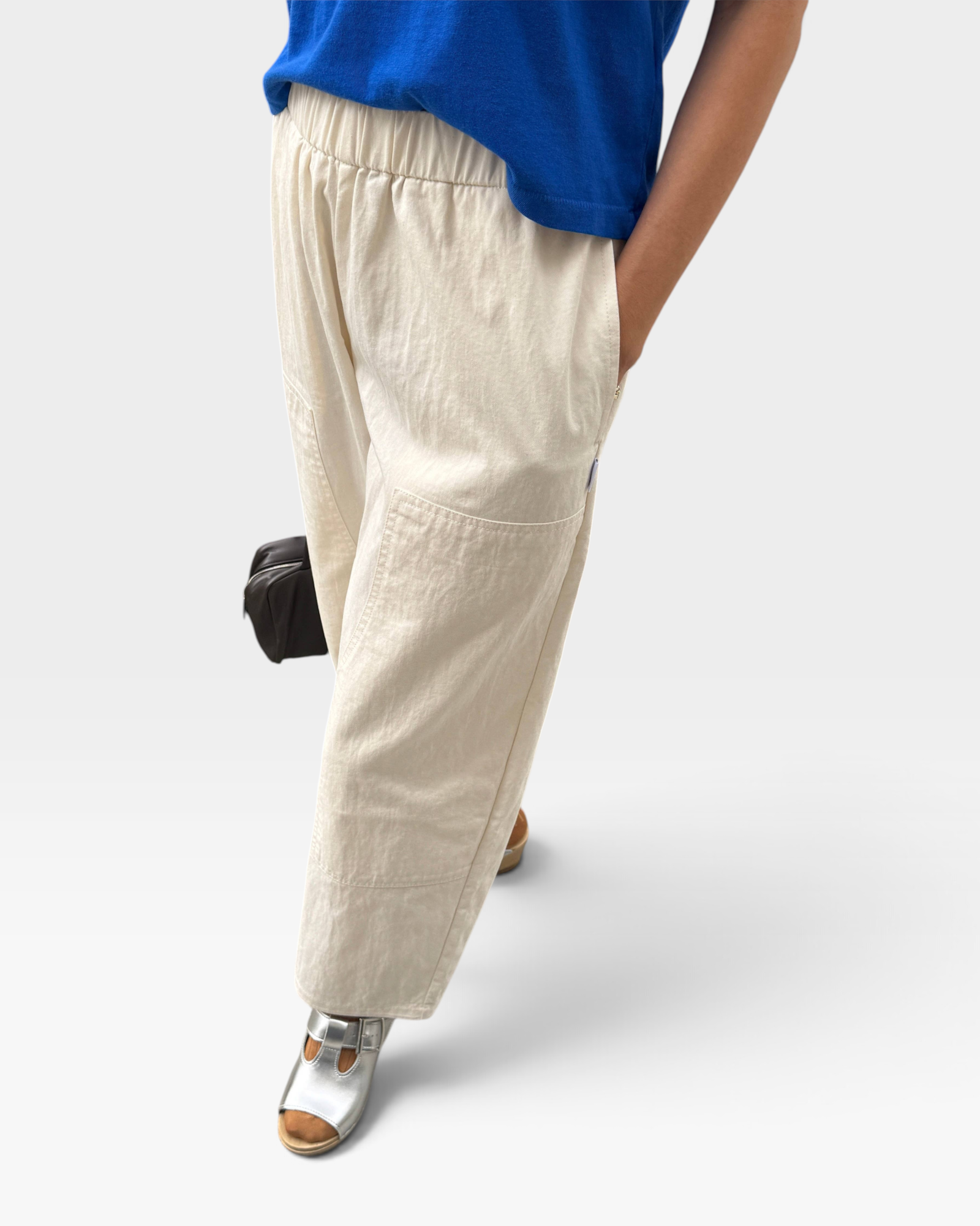JONES + CO ecru Gardener's Pants in lightweight cotton-nylon with an elastic drawstring waist and a relaxed tapered leg.