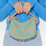 JONES + CO Elis Mini Crescent Bag in woven cognac calf leather with blue and green checkered pattern. Features knotted straps.