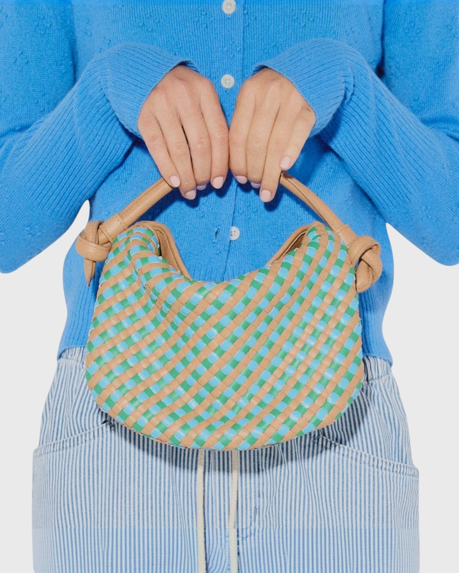 JONES + CO Elis Mini Crescent Bag in woven cognac calf leather with blue and green checkered pattern. Features knotted straps.