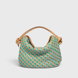 JONES + CO Elis Mini Crescent Bag in woven calfskin leather with blue and green checkered pattern and tan straps.