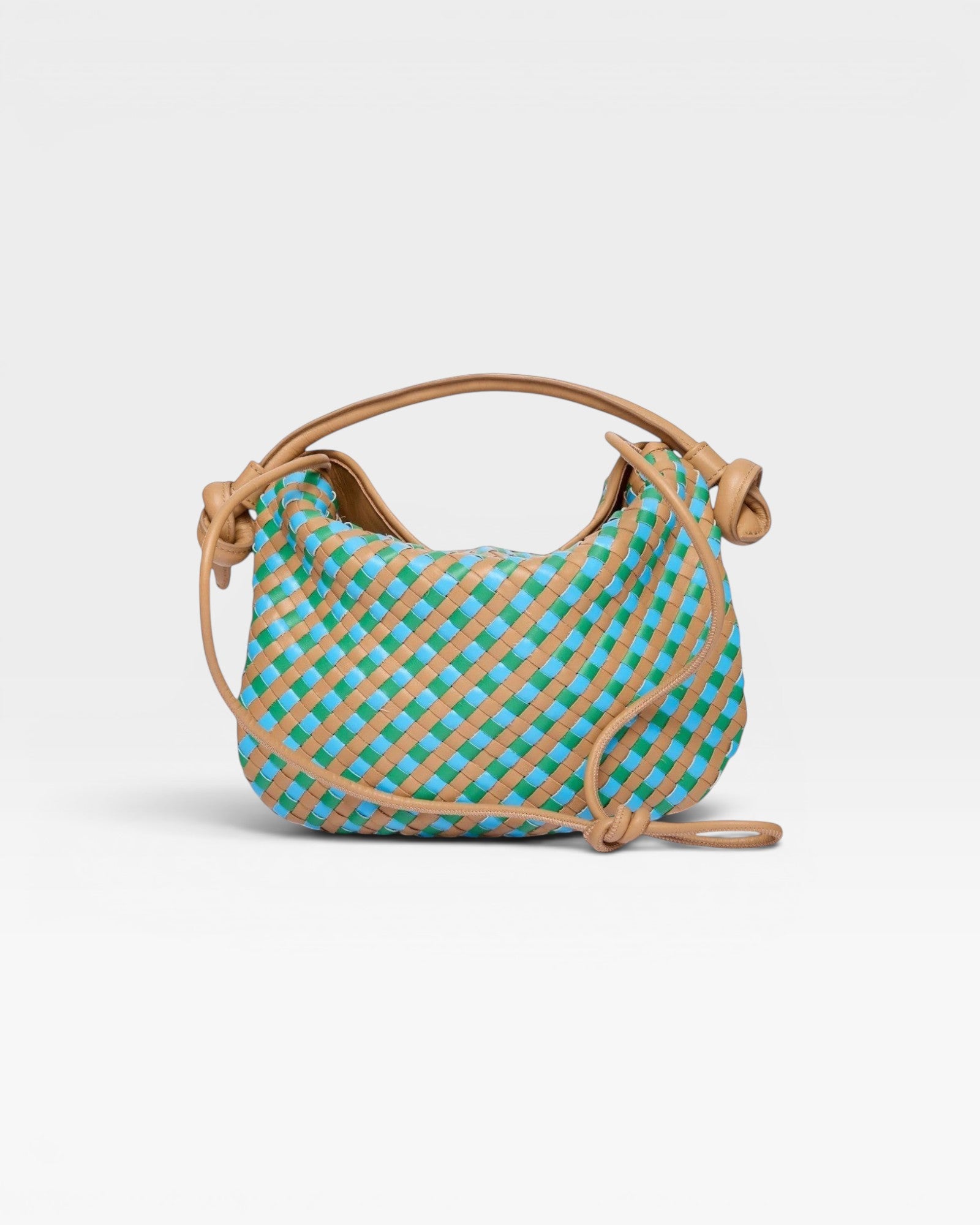 JONES + CO Elis Mini Crescent Bag in woven tan calfskin with blue and green checkered pattern. Features a slouchy shape and knotted strap details.