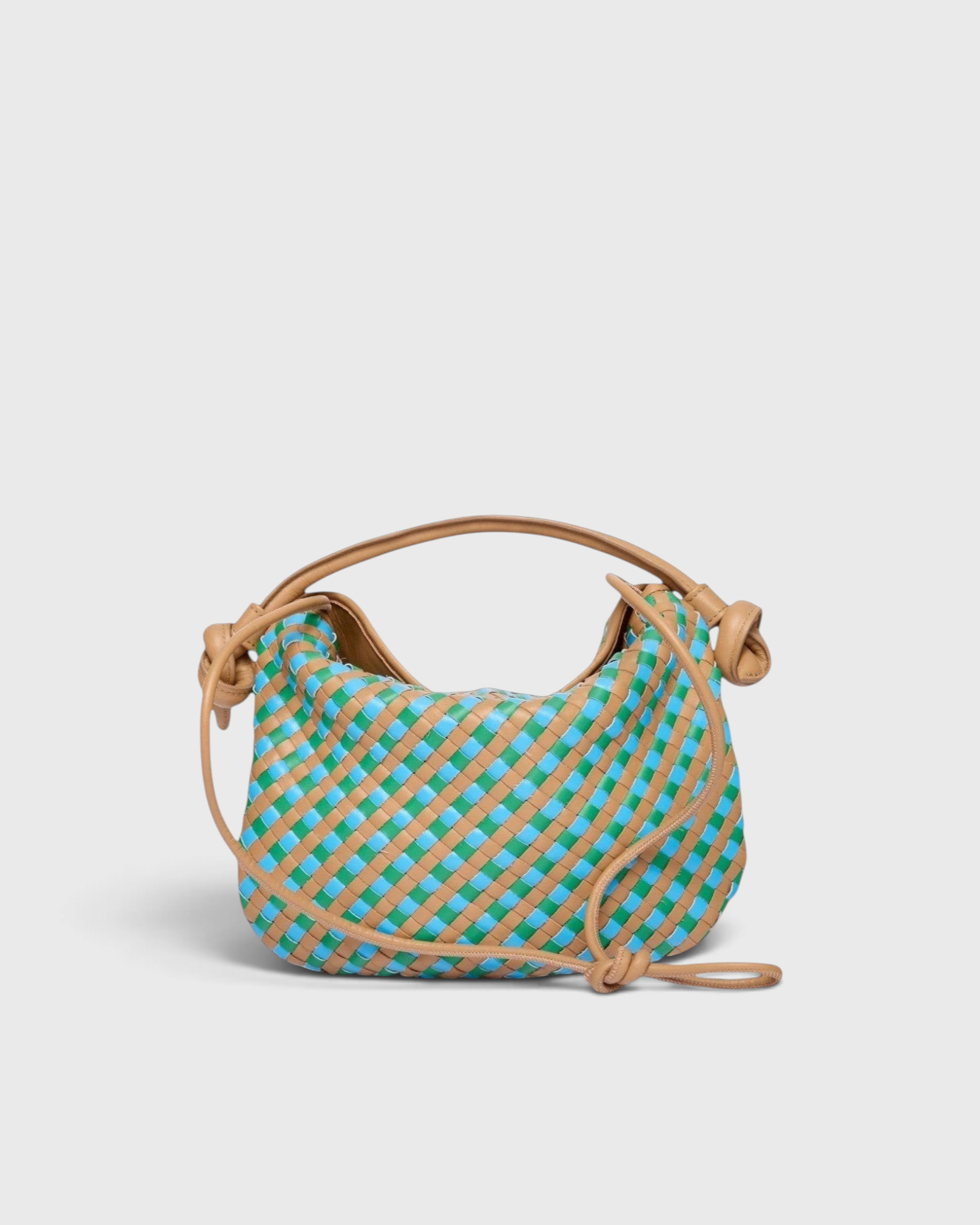 JONES + CO Elis Mini Crescent Bag in woven tan calfskin with blue and green checkered pattern. Features a slouchy shape and knotted strap details.
