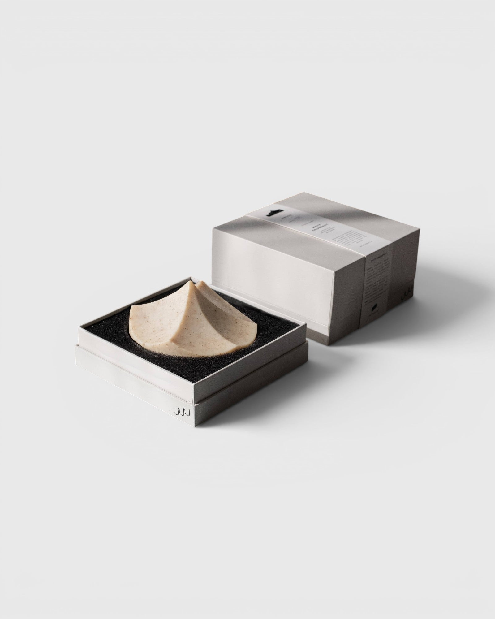 JONES + CO Erode Linden soap in a unique mountain-shaped design, presented in a minimalist gift box with botanical ingredients.