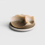 JONES + CO Erode soap in Cardamom Vetiver scent, featuring a unique sculpted shape on a matching Bouton plate.