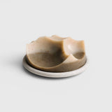 JONES + CO Erode soap in Cardamom Vetiver scent, featuring a unique sculpted shape on a matching Bouton plate.