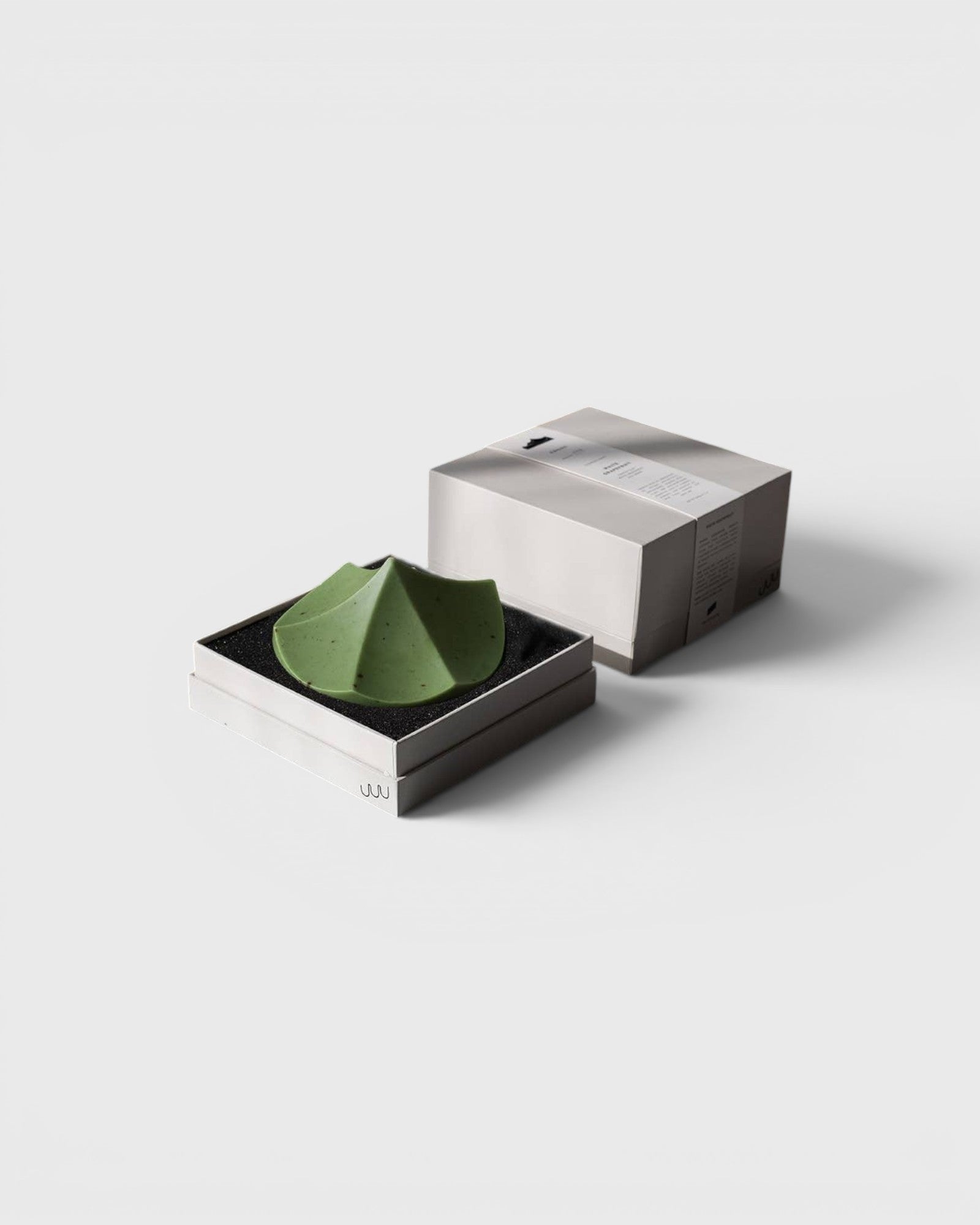 JONES + CO Erode Soap in Herbes de Provence, a green, mountain-shaped botanical soap in its minimalist gift box.