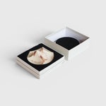 JONES + CO Erode Soap in Lavender Crème, a sculptural, marbled bar in a minimalist gift box with black foam insert.