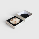 JONES + CO Erode Soap in Lavender Crème, a sculptural, marbled bar in a minimalist gift box with black foam insert.
