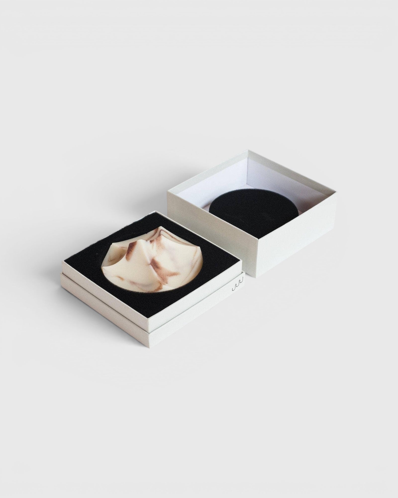 JONES + CO Erode Soap in Lavender Crème, a sculptural, marbled bar in a minimalist gift box with black foam insert.