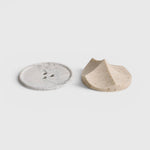 JONES + CO Erode Linden soap with botanical flecks next to a grey marbled Bouton soap dish on a white background.
