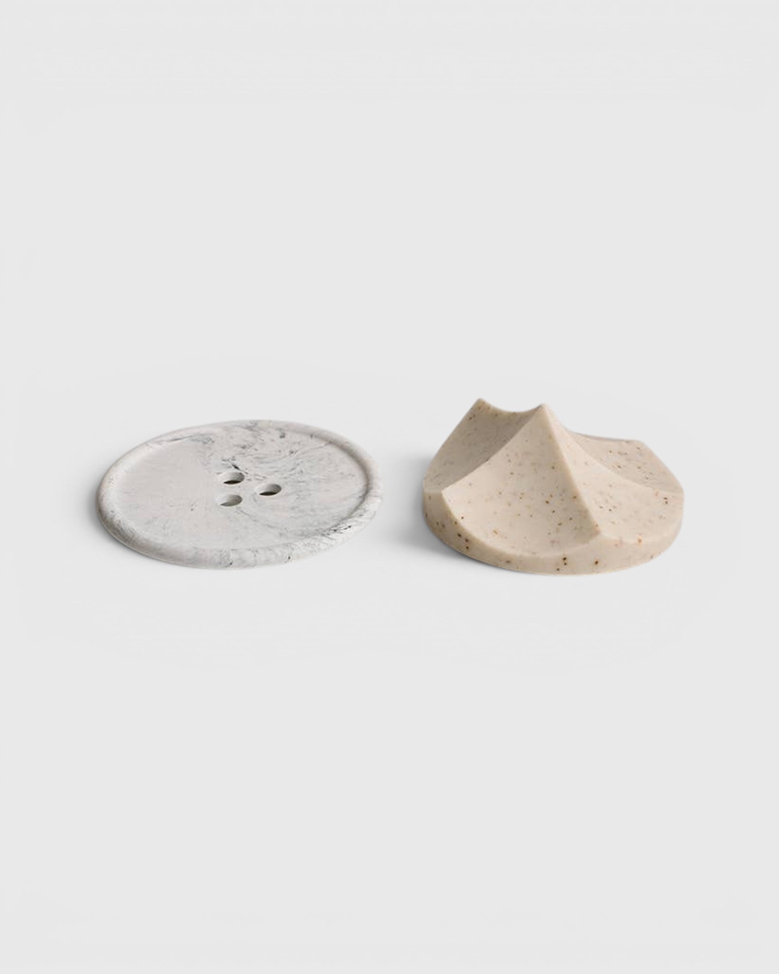 JONES + CO Erode Linden soap with botanical flecks next to a grey marbled Bouton soap dish on a white background.