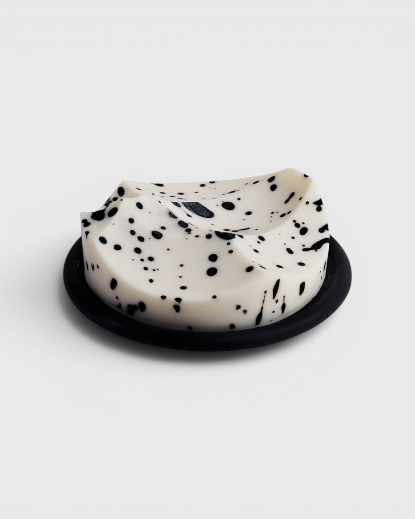JONES + CO UME Studio Erode Soap in white with black speckles, featuring a sculptural shape on a black base.