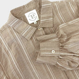 JONES + CO Esme Blouse in biscuit striped cotton poplin. Features lined puff sleeves, pearl buttons, and a covered placket.