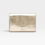 JONES + CO Esperia Medium Wallet in metallic platino cowhide leather with snap closure and accordion compartments.