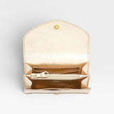 JONES + CO Esperia Medium Wallet in metallic platino leather with snap closure, zip coin pocket, card slots, and ID pockets.