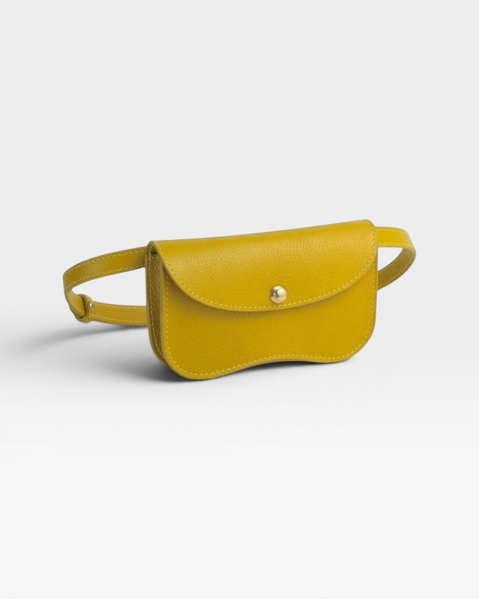JONES + CO Faba Fanny Bag in chartreuse leather with brass closure and adjustable strap. Can be worn on waist or chest.