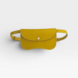 JONES + CO Faba Fanny Bag in chartreuse pebbled leather with brass snap closure and adjustable strap.