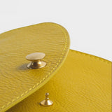 JONES + CO Faba Fanny Bag in chartreuse leather with brass hardware and stitching detail.