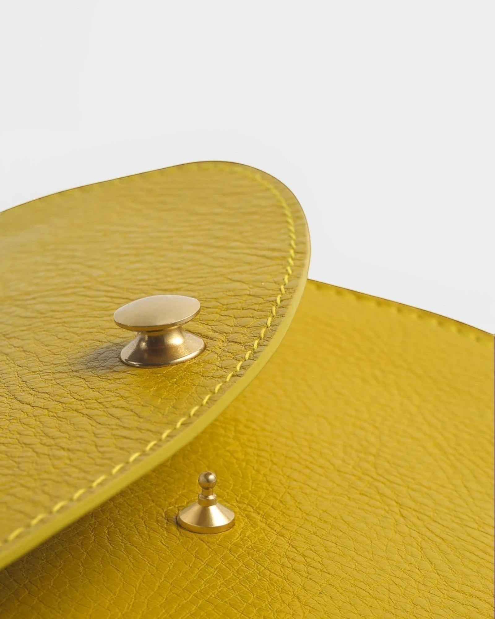 JONES + CO Faba Fanny Bag in chartreuse leather with brass hardware and stitching detail.