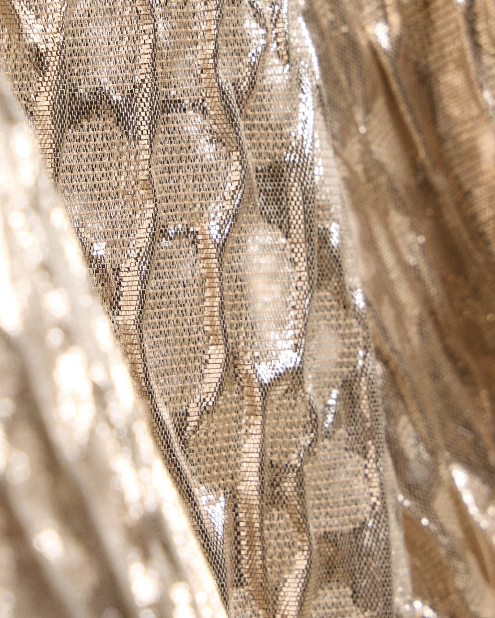 Close-up of JONES + CO Filly Top in champagne shimmery textured Crespi Silk fabric with a metallic weave.