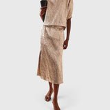 JONES + CO Filly Top in champagne shimmery textured silk with puff sleeves and boat neckline on a model