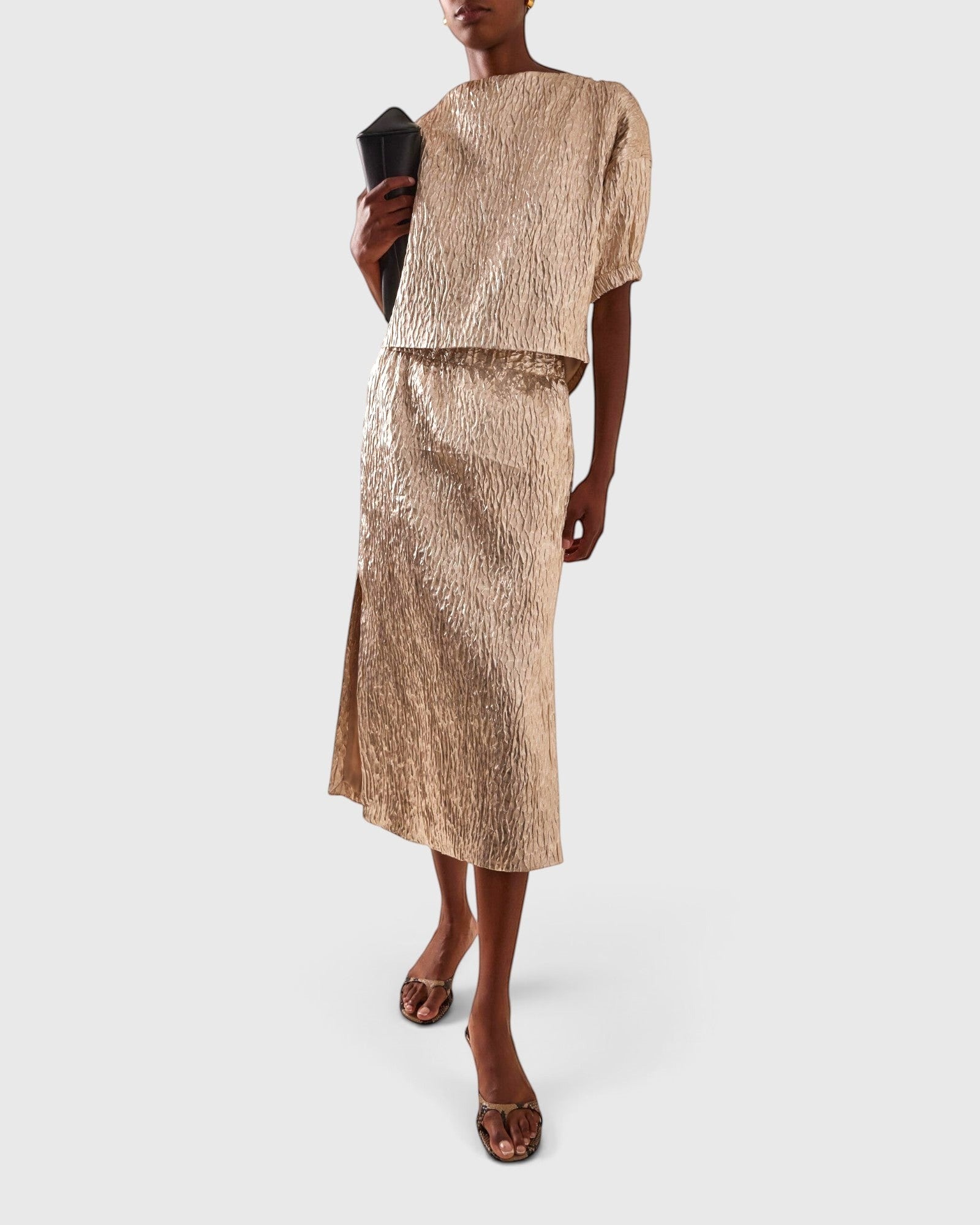JONES + CO Filly Top in champagne shimmery textured silk with puff sleeves and boat neckline on a model