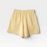 JONES + CO butter yellow 100% cotton heavyweight knit flared basketball shorts with raw texture.