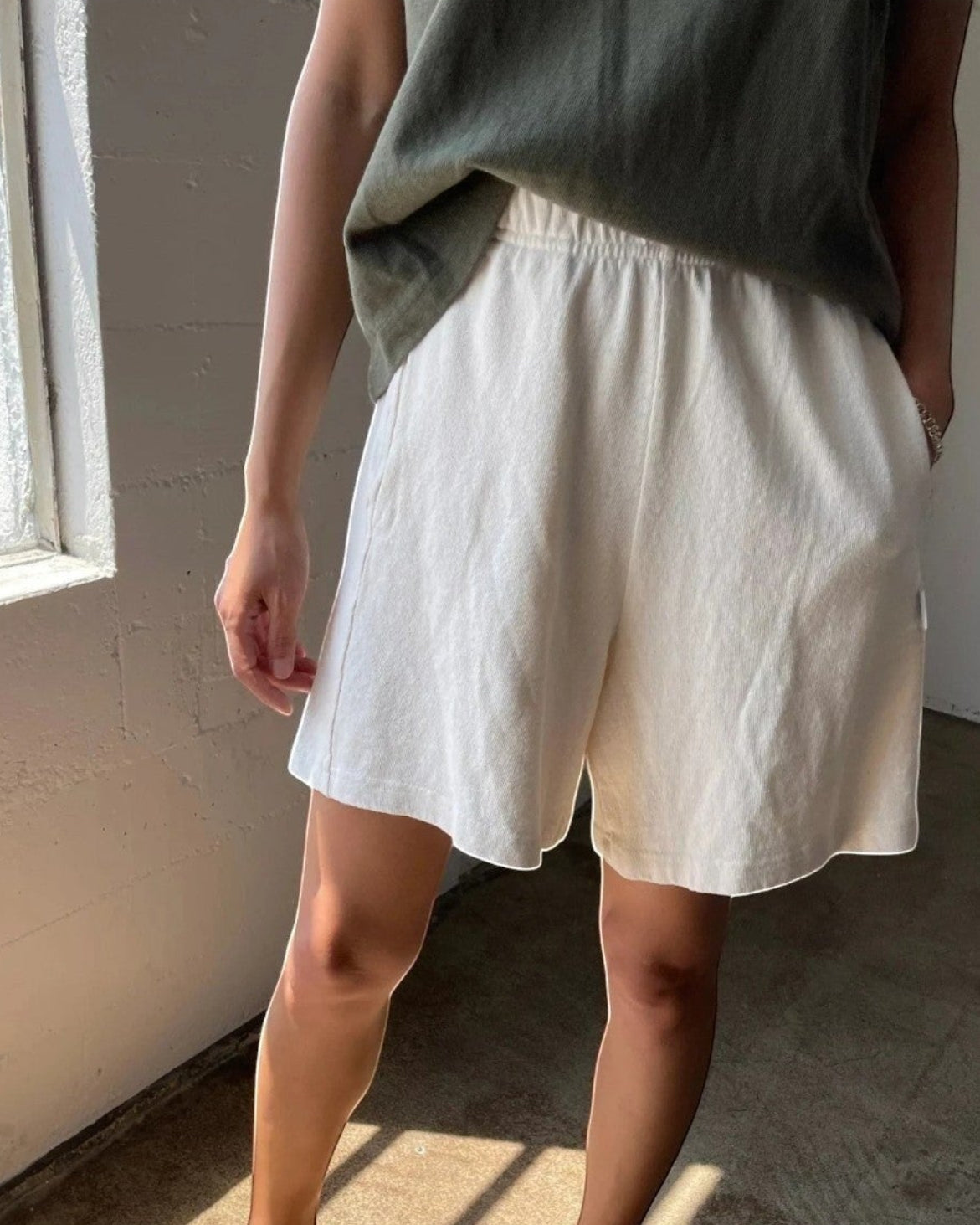 JONES + CO natural flared basketball shorts in 100% cotton heavyweight knit. Mid-thigh length.
