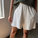 JONES + CO natural flared basketball shorts in 100% cotton heavyweight knit. Mid-thigh length.
