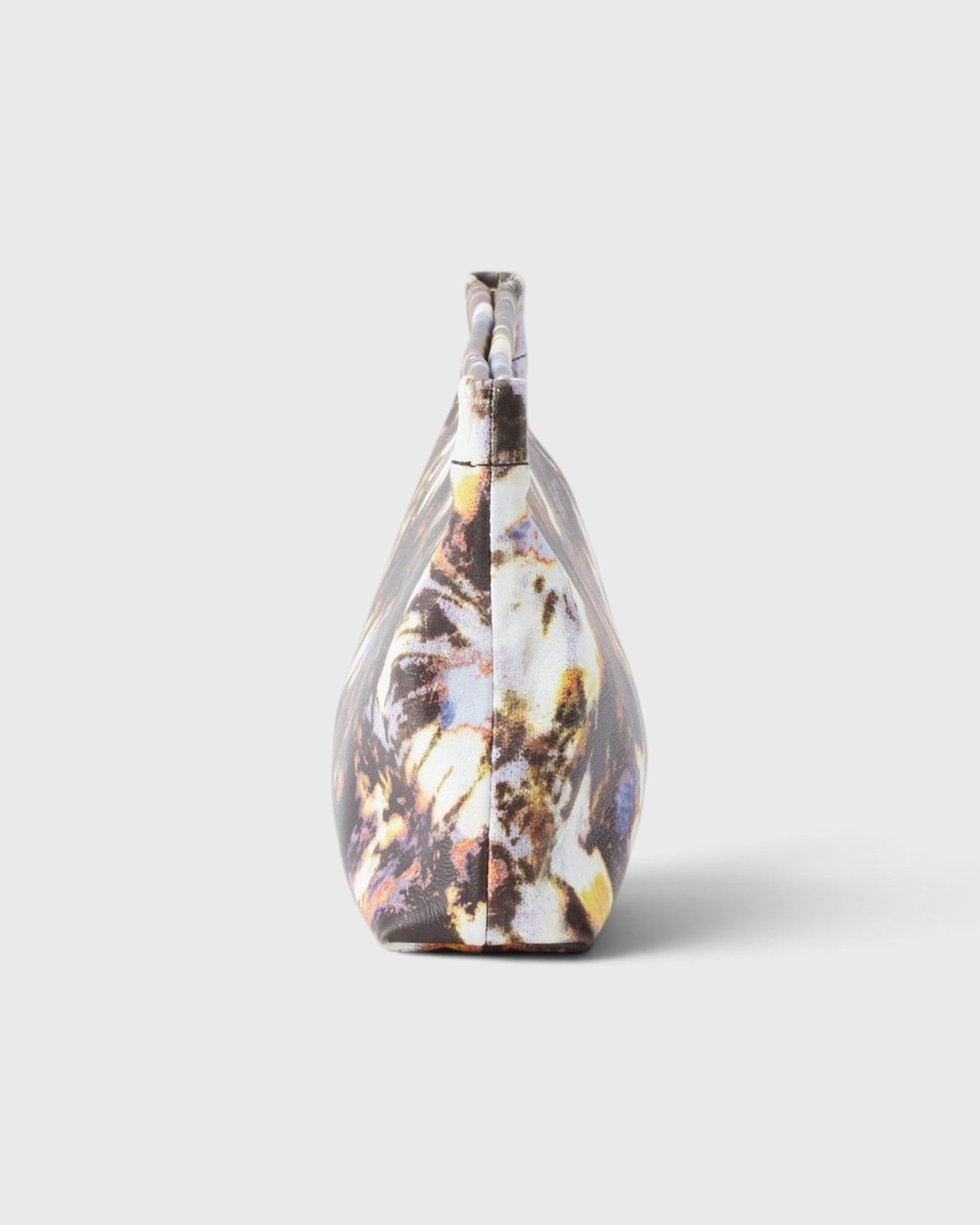 JONES + CO small envelope clutch with a watercolor abstract floral print and structured hinge closure side view
