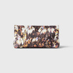 JONES + CO small envelope clutch with a dark watercolor abstract floral print and a secure hinge closure.