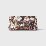 JONES + CO small envelope clutch with a dark watercolor abstract floral print and a secure hinge closure.