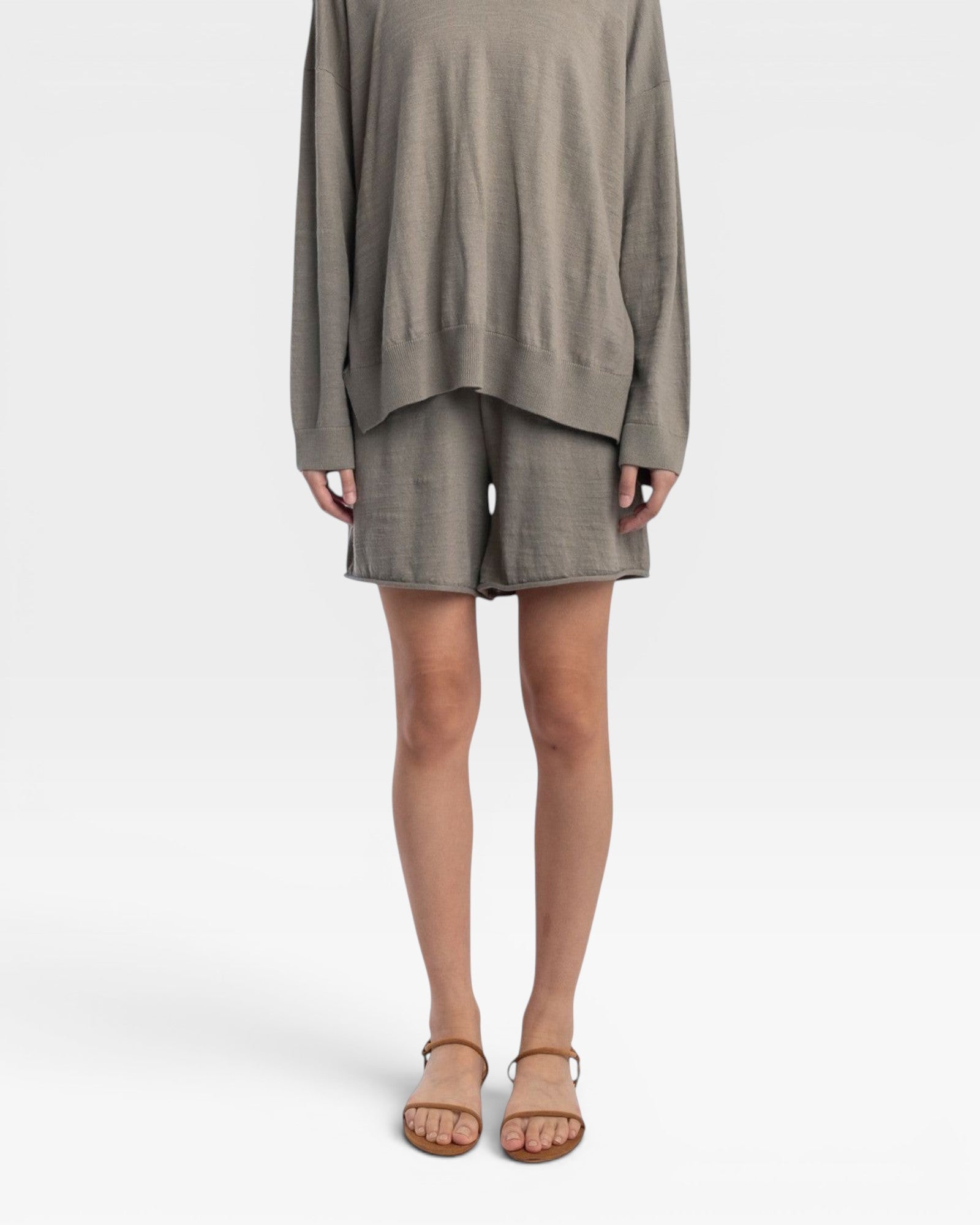 JONES + CO relaxed mid-length knit shorts in fog green with elastic waistband and drawstring. Fully fashioned.