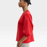 JONES + CO Rachel Comey Fond cherry red crewneck sweatshirt with drop shoulders, cropped sleeves, and raw edge hem.