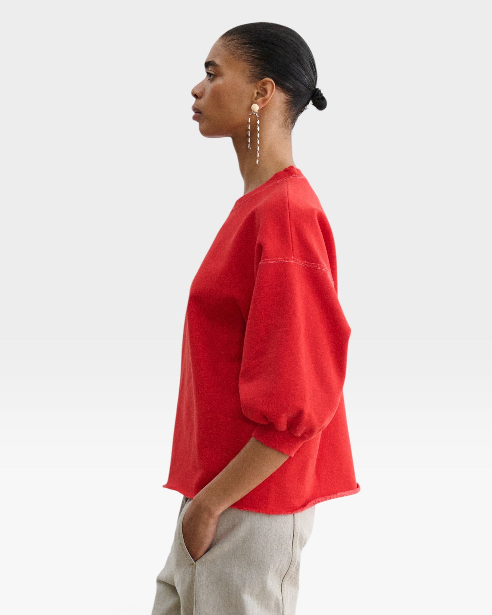 JONES + CO Rachel Comey Fond cherry red crewneck sweatshirt with drop shoulders, cropped sleeves, and raw edge hem.