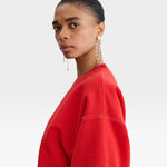 JONES + CO Rachel Comey Fond crewneck sweatshirt in cherry red with drop shoulders and visible white stitching