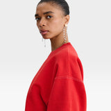 JONES + CO Rachel Comey Fond crewneck sweatshirt in cherry red with drop shoulders and visible white stitching