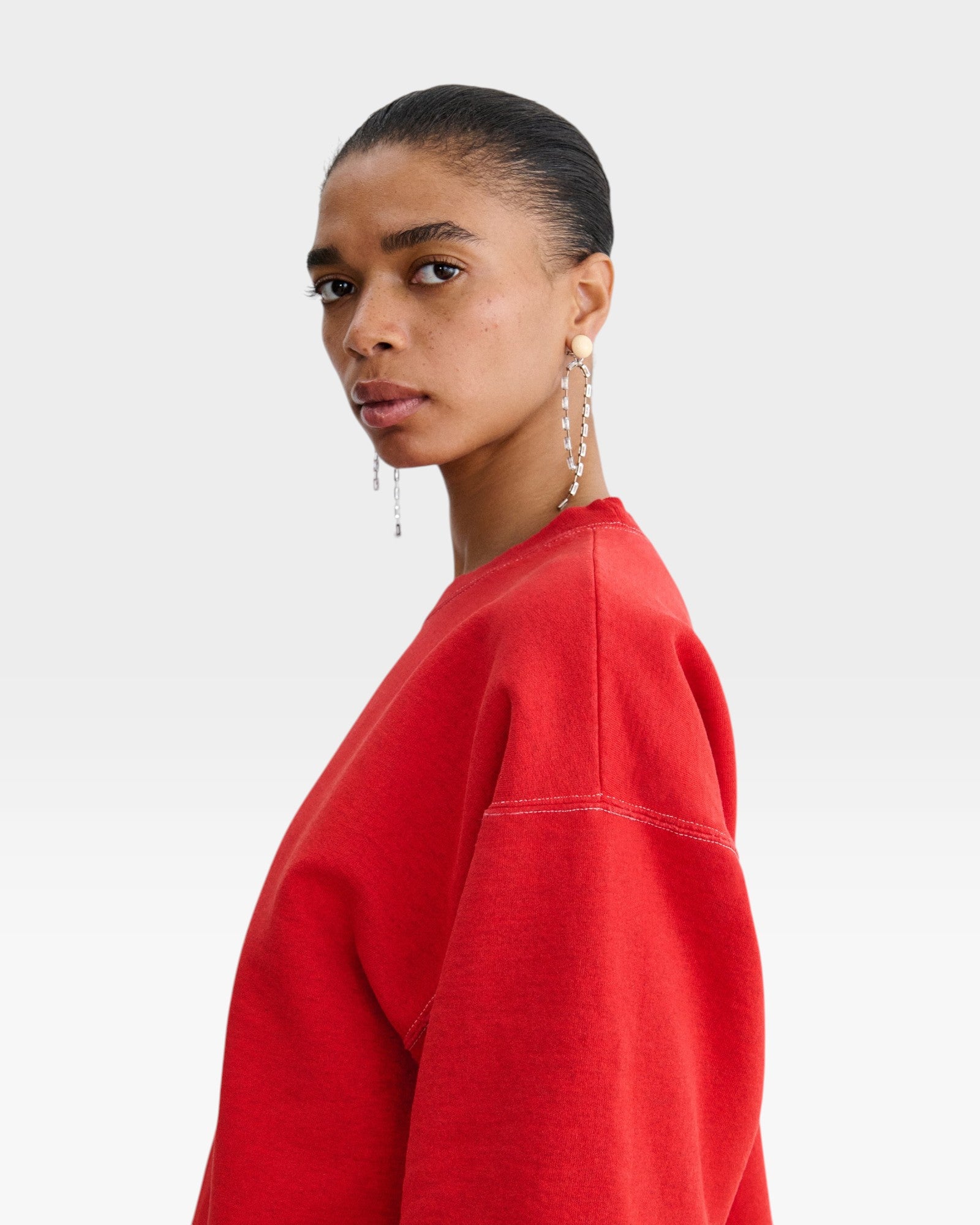 JONES + CO Rachel Comey Fond crewneck sweatshirt in cherry red with drop shoulders and visible white stitching