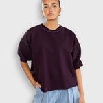 JONES + CO Rachel Comey Fond sweatshirt in plum with drop shoulders, cropped sleeves, and raw edge hemline.