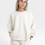 JONES + CO Fond Sweatshirt in dirty white cotton, featuring drop shoulders, raw hem, and distressing.