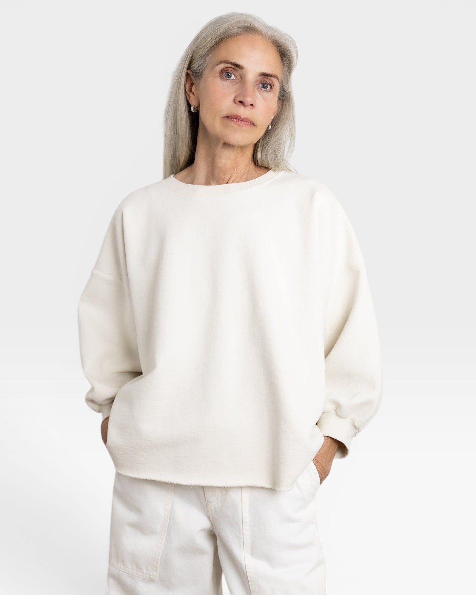 JONES + CO Fond Sweatshirt in dirty white cotton, featuring drop shoulders, raw hem, and distressing.