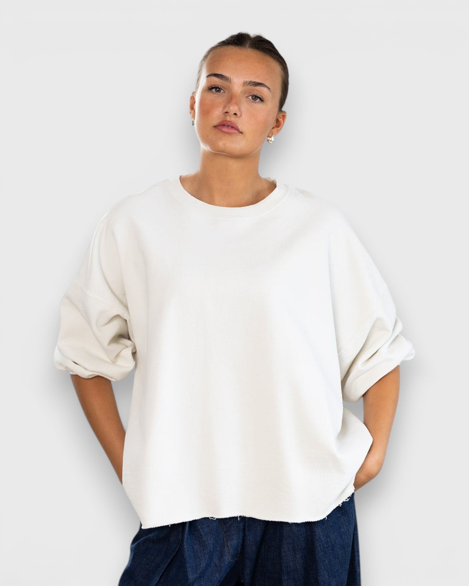 JONES + CO Rachel Comey Fond crewneck sweatshirt in dirty white with drop shoulders and raw edge hemline