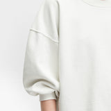 JONES + CO Rachel Comey Fond crewneck sweatshirt in dirty white with drop shoulders and raw edge hemline