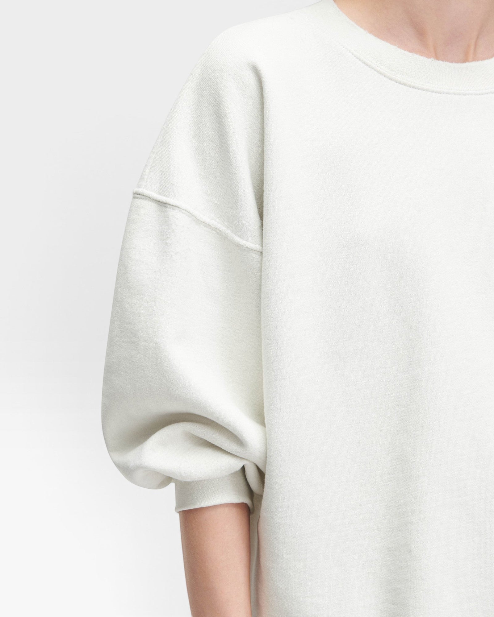 JONES + CO Rachel Comey Fond crewneck sweatshirt in dirty white with drop shoulders and raw edge hemline