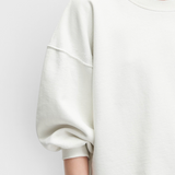 JONES + CO Rachel Comey Fond crewneck sweatshirt in dirty white with drop shoulders and raw edge hemline